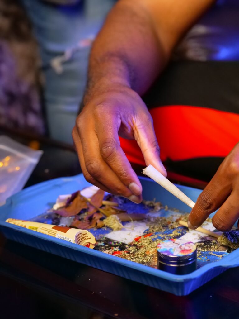 Close-Up Photo of Filling Weed on Rolling Paper